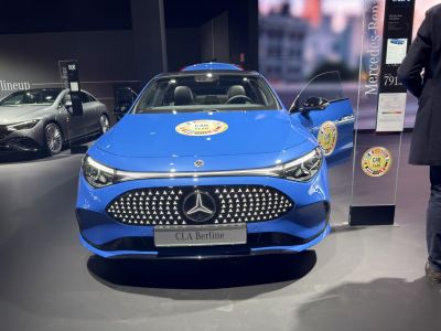Blue Mercedes-Benz CLA Saloon front with LED grille and open door
