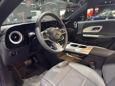 Modern luxury car interior with steering wheel and dashboard