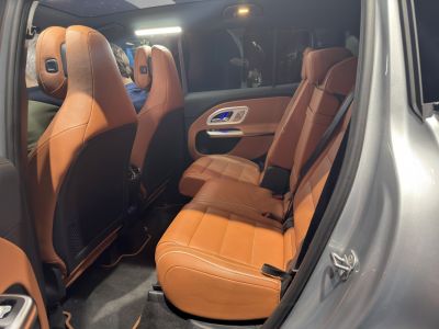 Rear passenger seat area with premium leather upholstery and modern door panel