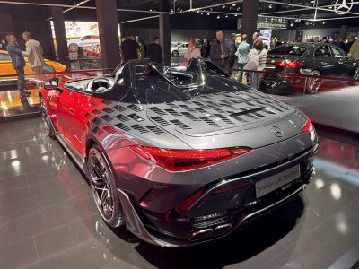 Rear view with twin-peak rear pods and aerodynamic design features.