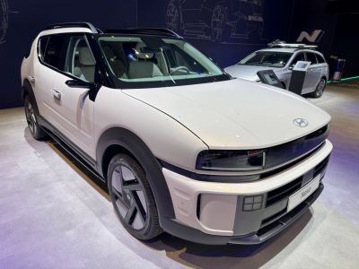 Sleek front view with LED headlights and distinctive grille