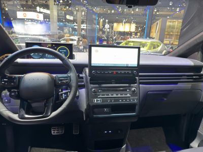 Interior dashboard with digital displays and steering wheel controls
