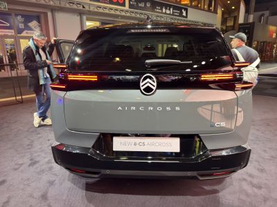 Rear view with LED tail lights and electric SUV branding