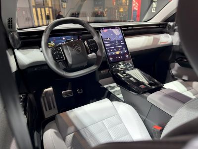 Futuristic dashboard with digital cluster and vertical touchscreen center console