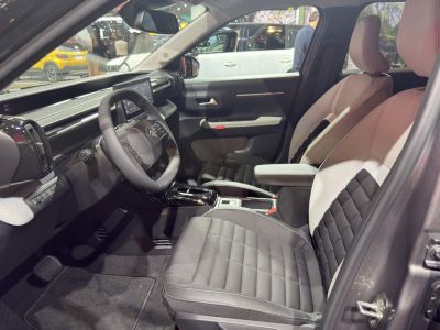 Modern dashboard and comfortable front seats inside a car