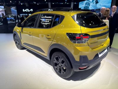 Rear side view with black alloy wheels and modern taillights