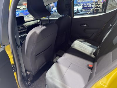 Rear interior space with fabric seats and front cabin visible