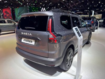 Rear view with sleek taillight and roof rack design.