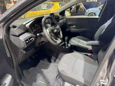 Manual transmission cabin with modern dashboard and fabric seats