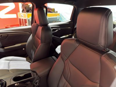 Close-up of leather front seats in a vehicle interior.