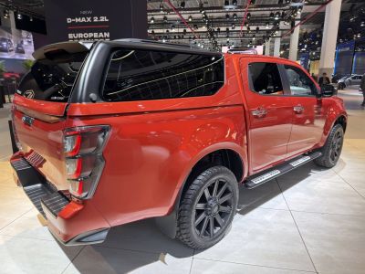 Pickup truck with rear canopy and black alloy wheels