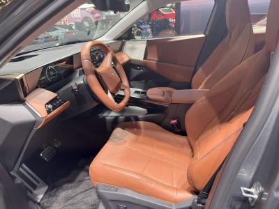 Brown leather seats and digital dashboard in car interior