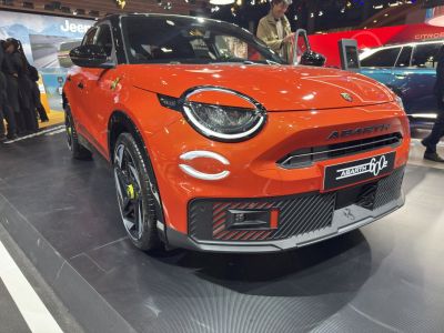 Front view with circular LED headlights and aggressive bumper design