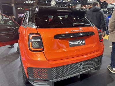Rear view of a sporty hatchback with distinctive LED tail lights and rear spoiler.