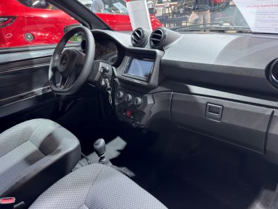 Dashboard, steering wheel, touchscreen, manual transmission interior.