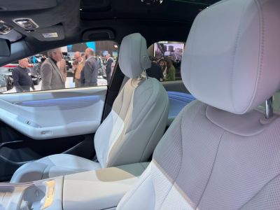 White leather luxury seats and modern door panel interior.