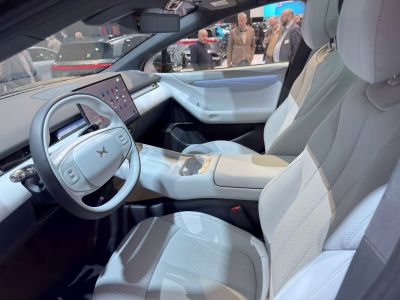 Minimalist car interior with digital display and premium seats