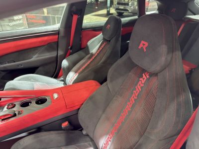 Sport seats with red accents and detailed stitching