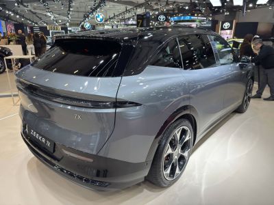 Sleek rear and side view of modern electric SUV with aerodynamic lines and alloy wheels