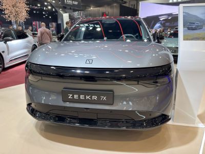 Front view of sleek electric SUV with LED headlights and smooth design