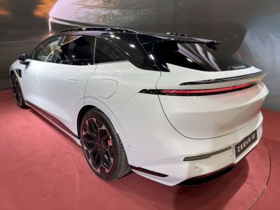 Rear and side view showing sleek aerodynamic lines and multi-spoke wheels