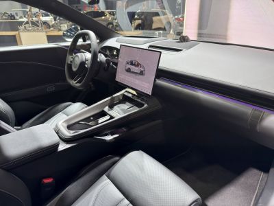 Futuristic dashboard with large touchscreen and sleek interior details