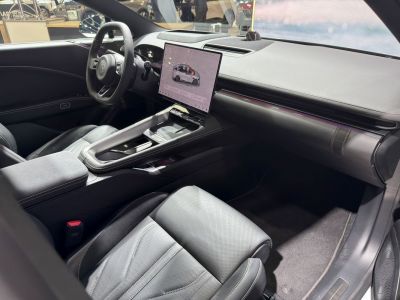 Minimalist dashboard, large digital touchscreen, premium leather seating