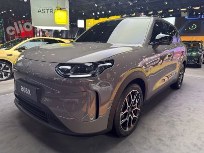Front profile with modern LED headlights and alloy wheels of sleek SUV