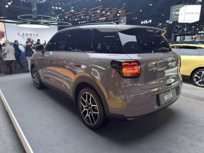 Rear and side view of a sleek electric SUV with LED taillights and distinctive alloy wheels.