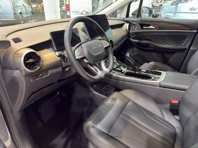 Modern car interior with digital dashboard and leather seats