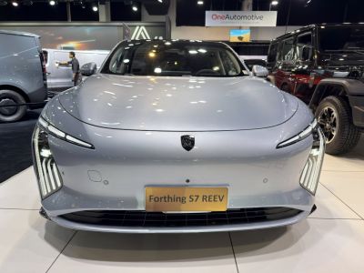 Front view with sleek LED headlights and smooth aerodynamic hood