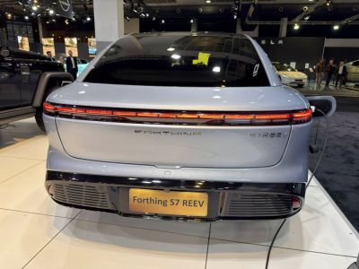 Rear view of electric vehicle with LED light bar and charging port