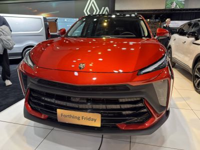 Front view with sleek headlights and bold grille design