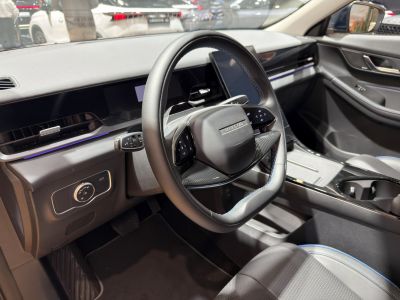 Futuristic steering wheel and sleek dashboard with integrated digital displays