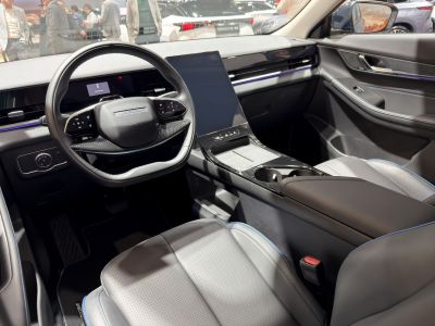 Modern car interior with large touchscreen and digital dashboard