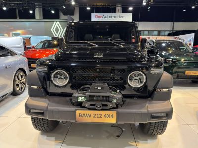Front view with round LED headlights and mounted vehicle winch