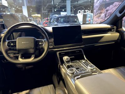 Modern vehicle interior with digital dashboard and large touchscreen display
