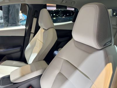 White leather seats with integrated Bose speaker headrests