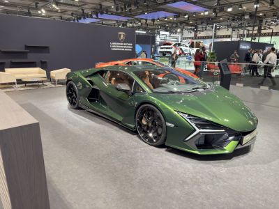 Green hybrid sports car with sharp angular design and black wheels