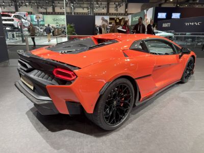Rear design with black multi-spoke wheels and carbon fiber diffuser