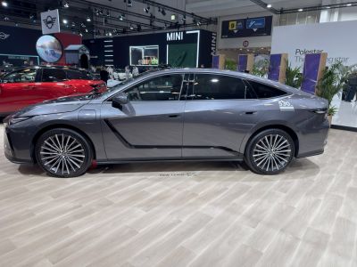 Side profile of a sleek electric sedan with alloy wheels and aerodynamic styling