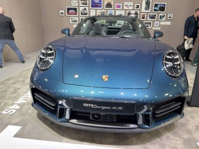 Front view with iconic round headlights and aerodynamic fascia