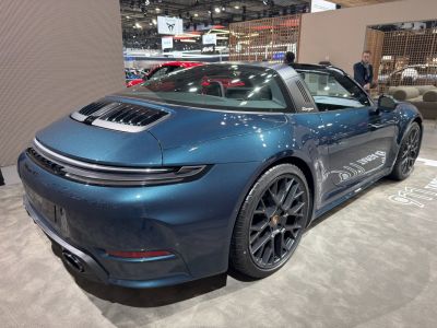 Rear and side view of sleek sports coupe with Targa roof and sporty wheels