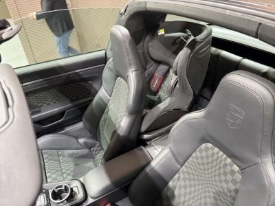 Luxurious black leather and checkered upholstery with Porsche embroidery on seats