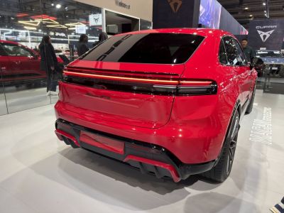 Sleek rear design with continuous LED light bar and sporty diffuser.