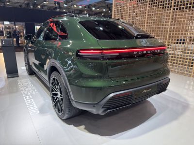 Sleek rear of an electric SUV with LED light bar and sport rims