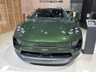Front view of electric SUV with LED headlights and bold grille design