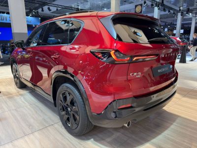 Rear view with LED taillights, black wheels, AWD badge on red SUV