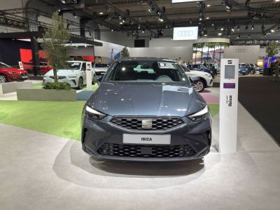 Front view with sharp LED headlights and hexagonal honeycomb grille