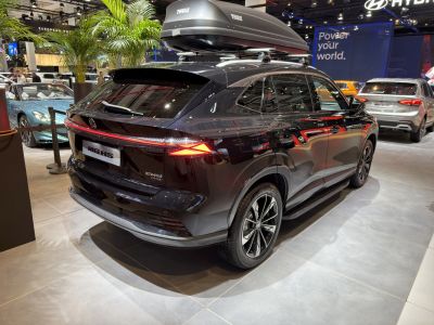 Rear view of SUV with roof cargo box and sleek rear lights